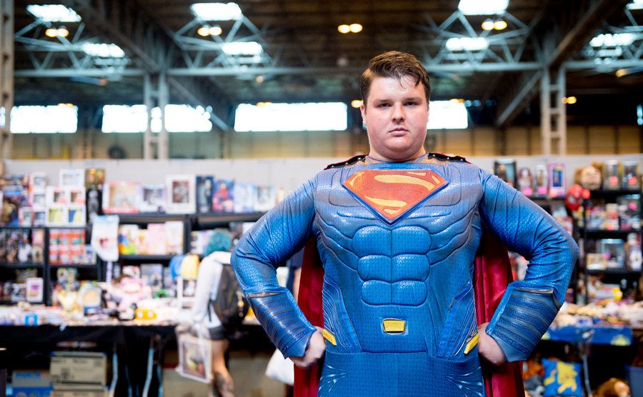 A cosplayer in character as Superman.