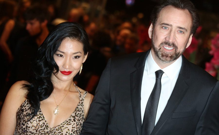 Alice Kim and Nicolas Cage attend an event. 