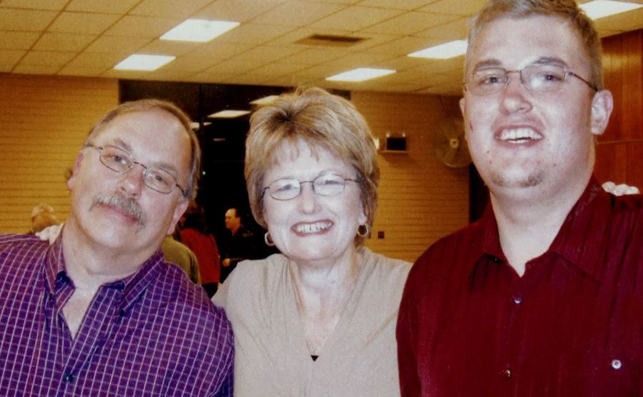 A picture of Brandon with his parents.