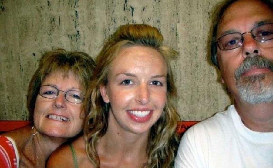 A picture of a younger Laura with her parents.