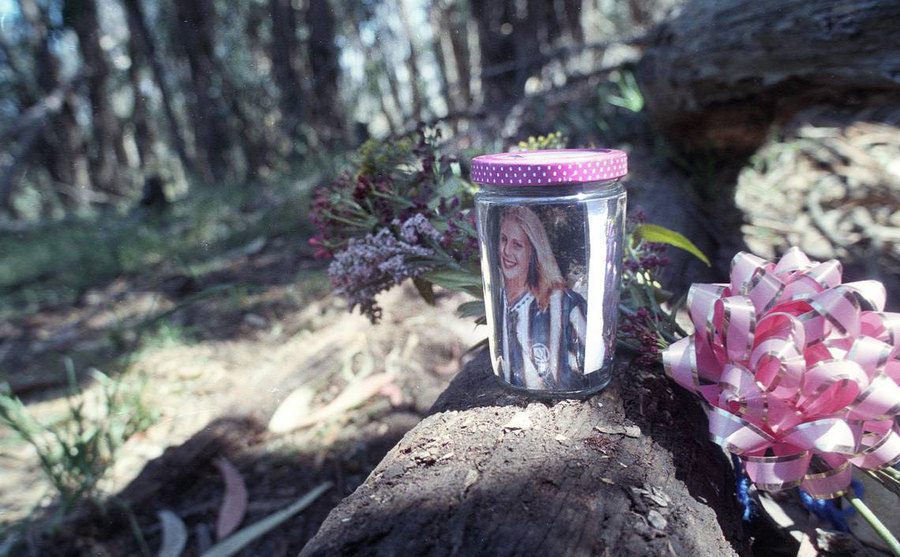 A jar with her Elyse’s photo near the woods where her body was found.