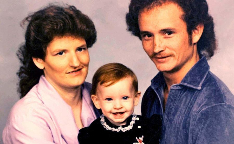 A portrait of Tracey, Carl, and their daughter Carolyn.