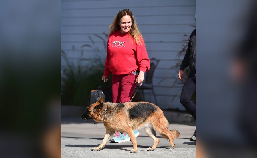 Catherine Bach is out walking her dog. 
