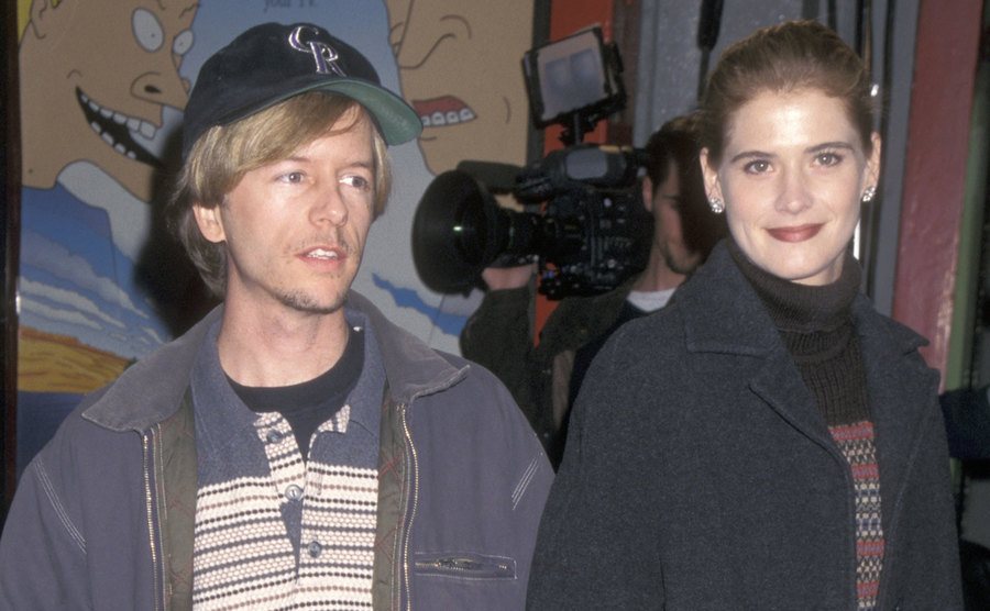 David Spade and Kristy Swanson attend an event.