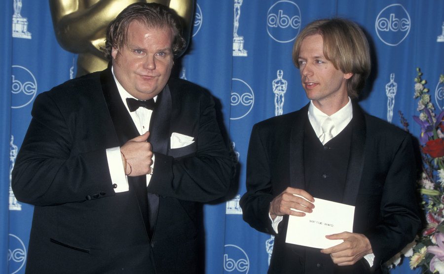Chris Farley and David Spade pose backstage at the Annual Academy Awards.