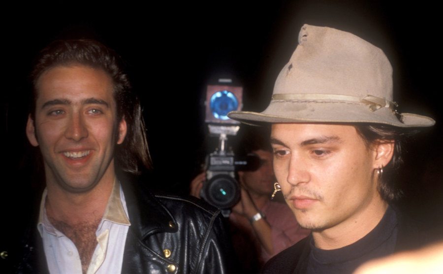 Nicholas Cage and Johnny Depp attend an event.