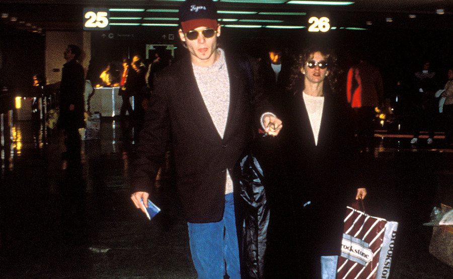Johnny Depp and Jennifer Grey are arriving at the airport.