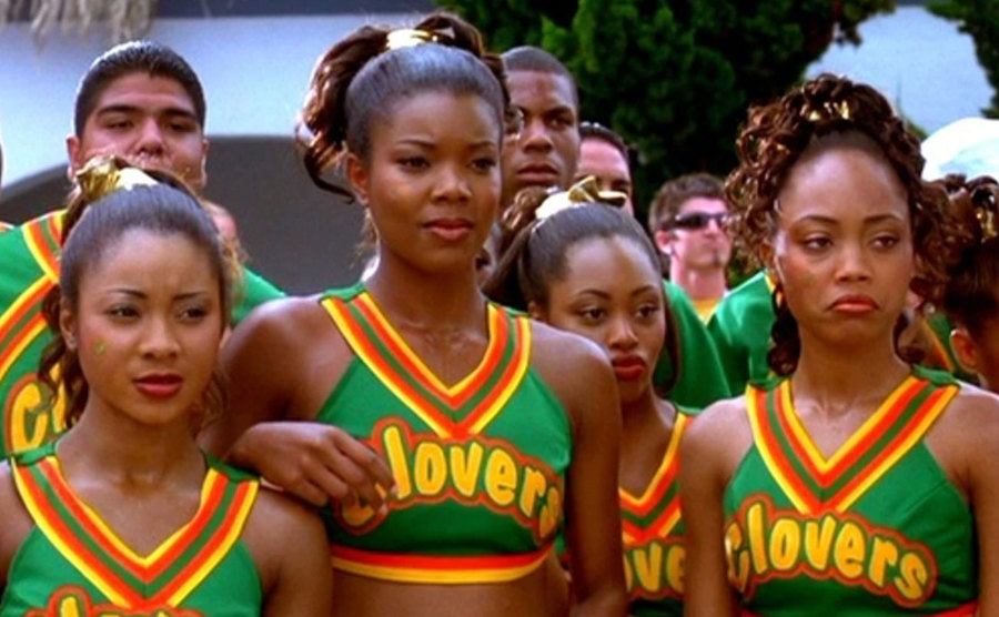 Gabrielle Union stands with the rest of the Clovers in a still from the film. 