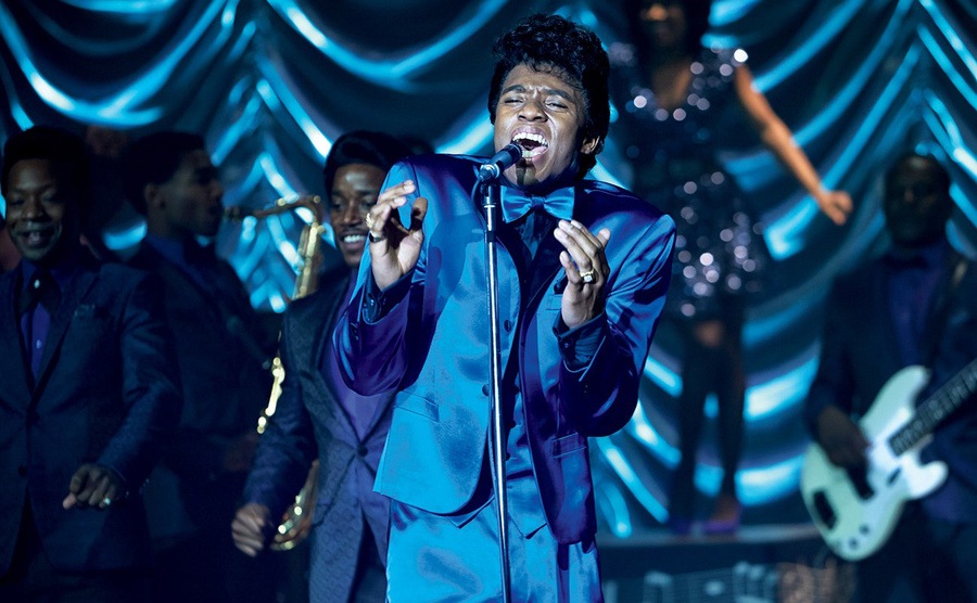 Chadwick Boseman, as James Brown, performs on stage. 