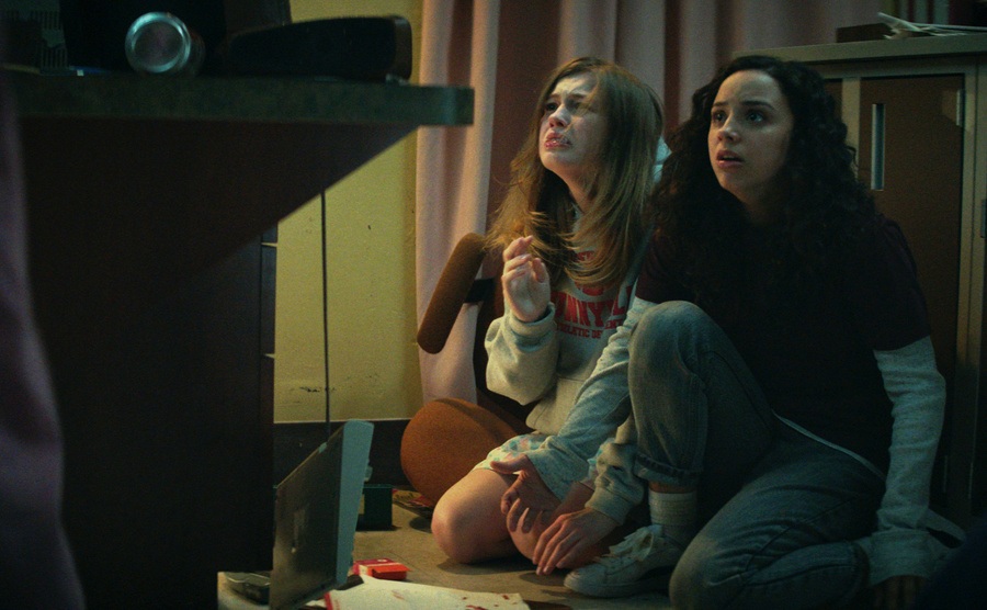 Kiana Madeira and Olivia Scott Welch look terrified in a scene from Fear Street