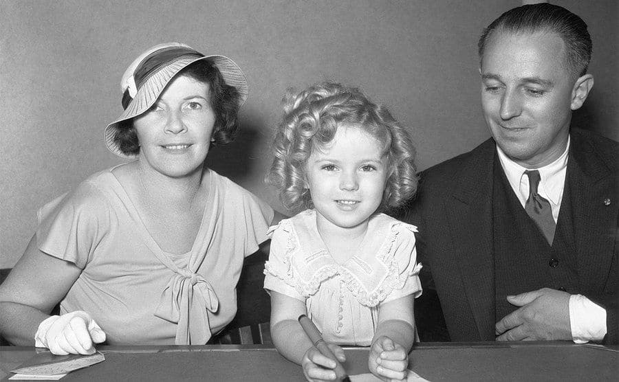 Little Shirley Temple is pictured with her parents. 