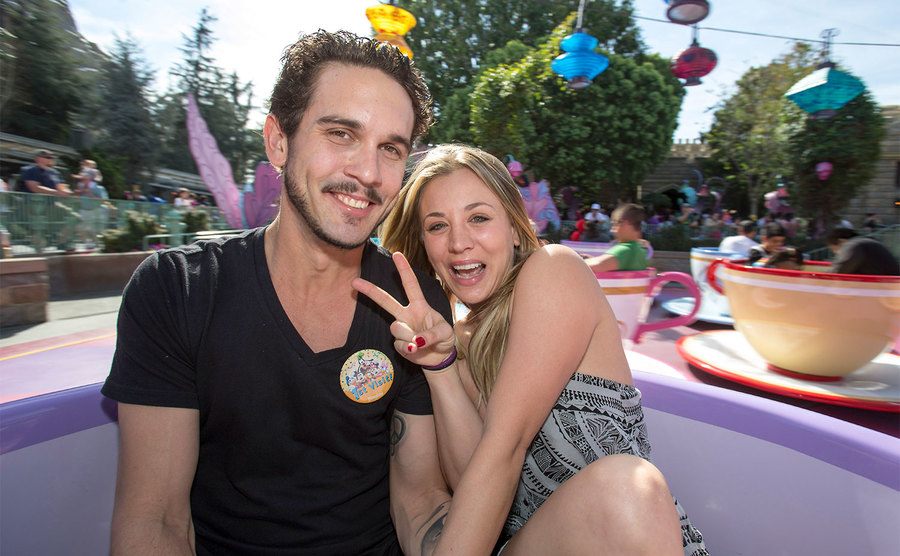 Ryan Sweeting and Kaley Cuoco take a ride on The Mad Tea Party attraction at Disneyland. 