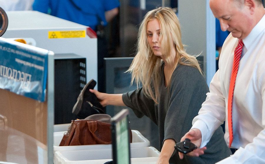 Kaley Cuoco stands in the security line at the airport 