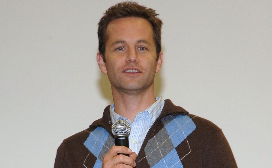 A photo of Kirk Cameron speaking on the microphone.