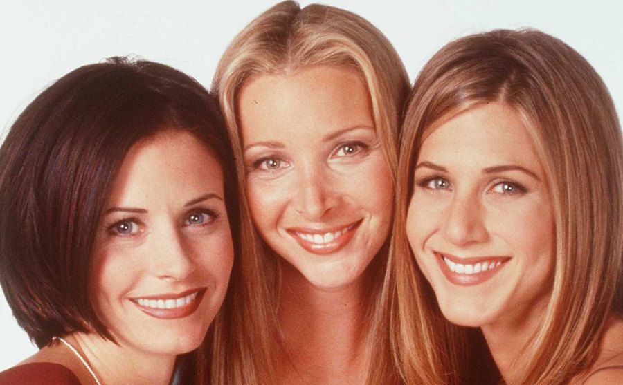 Courteney Cox, Lisa Kudrow, and Jennifer Aniston pose for a portrait.