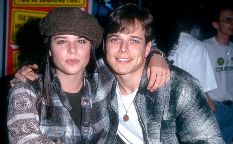 Neve Campbell and Scott Wolf pose for a portrait. 