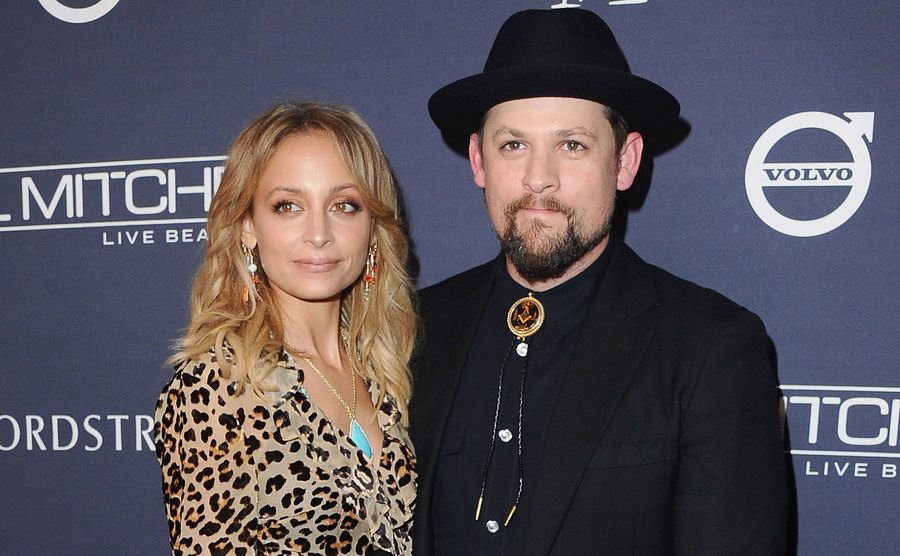 Nicole Richie and Joel Madden attend an event.