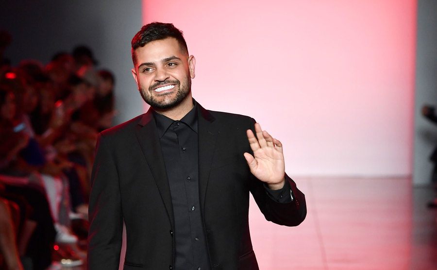 Michael Costello is walking the runway at his fashion show.