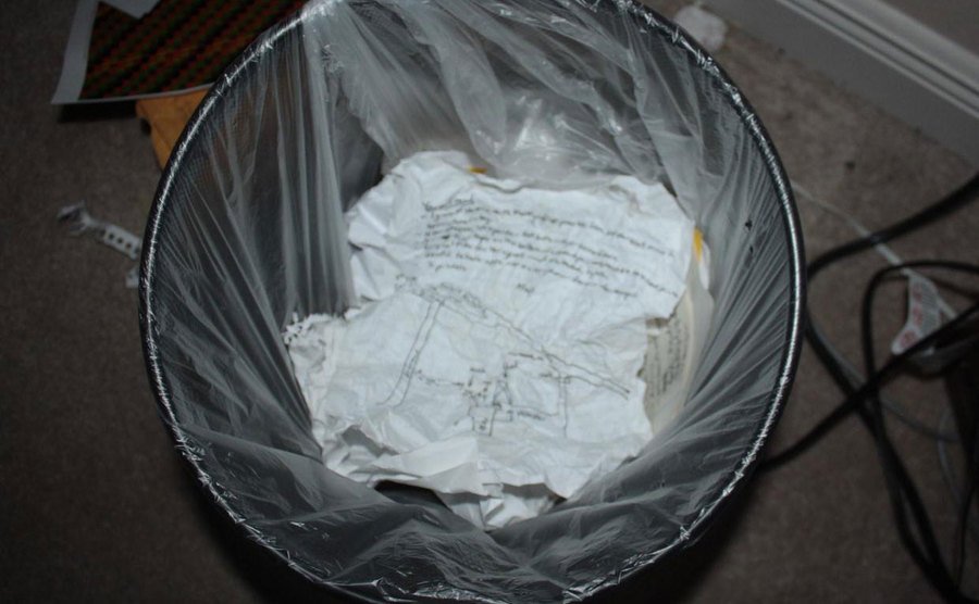 A photo of the murder plan’s sketch thrown in a garbage can. 