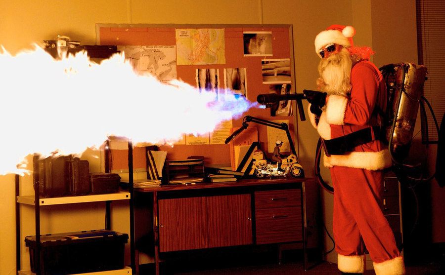 Santa is using a flame thrower. 