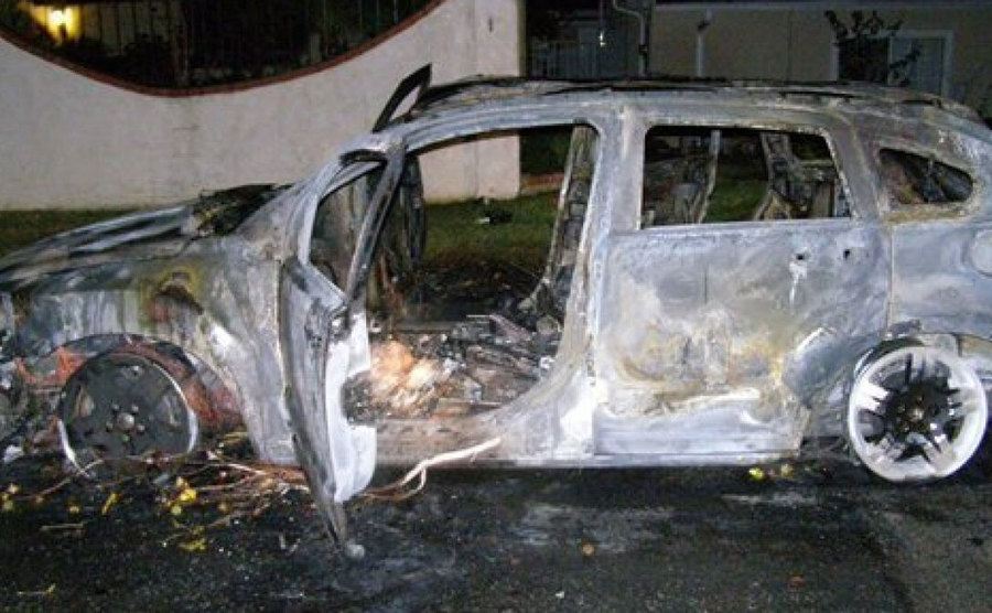 Bruce’s torched car after the explosion. 