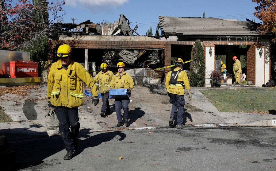 Fire Fighters remove debris from the Ortega home. 