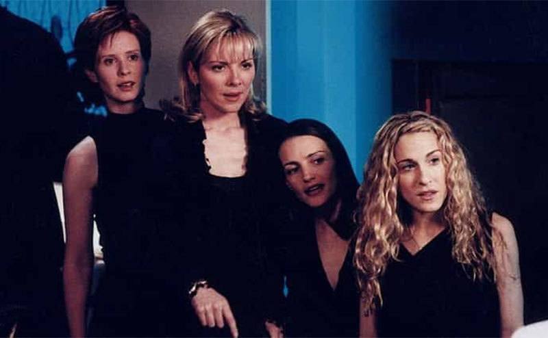 Miranda, Sam, Charlotte, and Carrie look shocked in a still from SATC. 