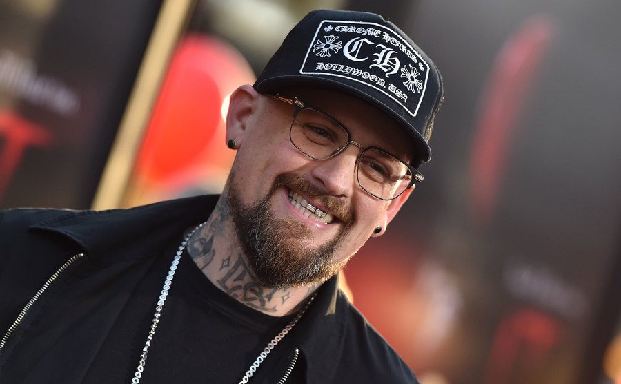 Benji Madden smiles as he poses for the press.