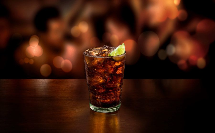 An image of an ice-cold drink in a wooden bar.