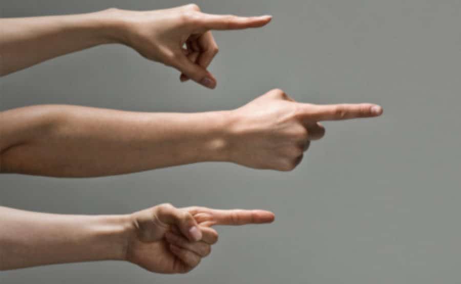 An image of hands pointing their fingers.