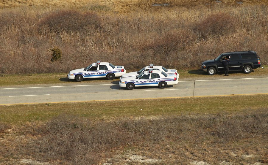 An aerial view of police cars near where a body was discovered.