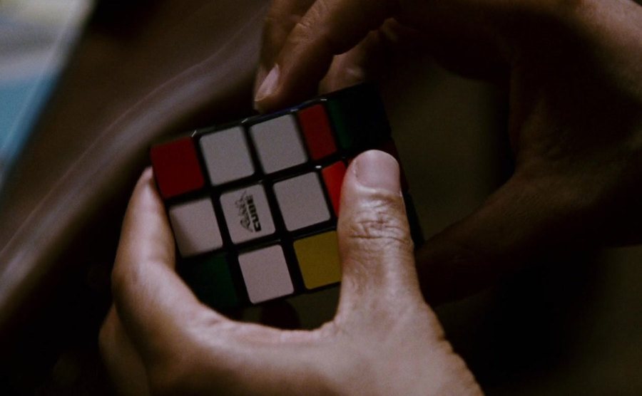 A closeup on Will Smith’s hands in the Rubik’s cube scene.