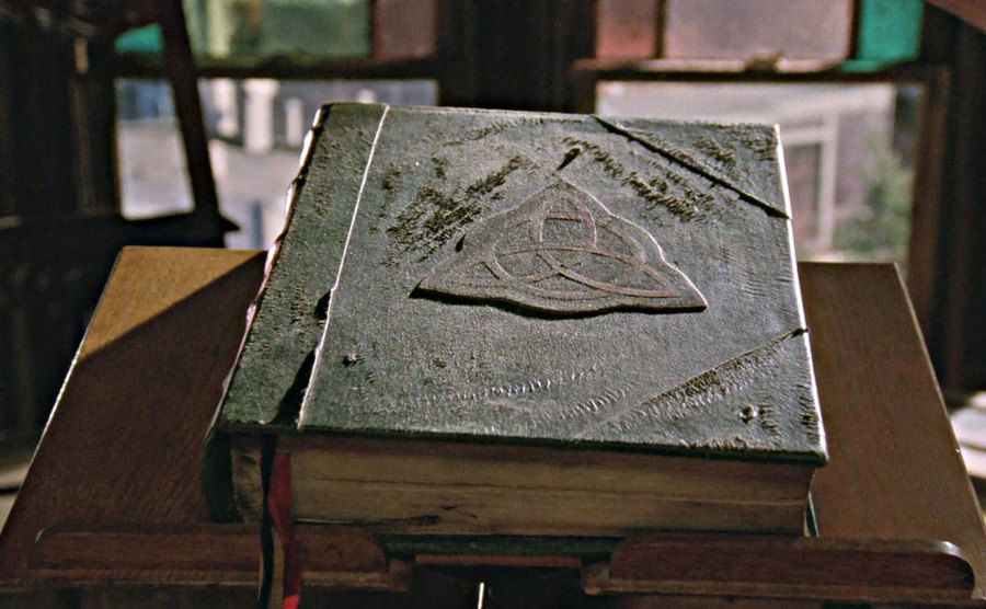 A closeup on the Book of Shadows in a still from the series.