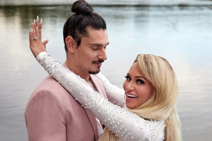 Darcey and Georgi Rusev pose together while Darcey shows off her ring. 