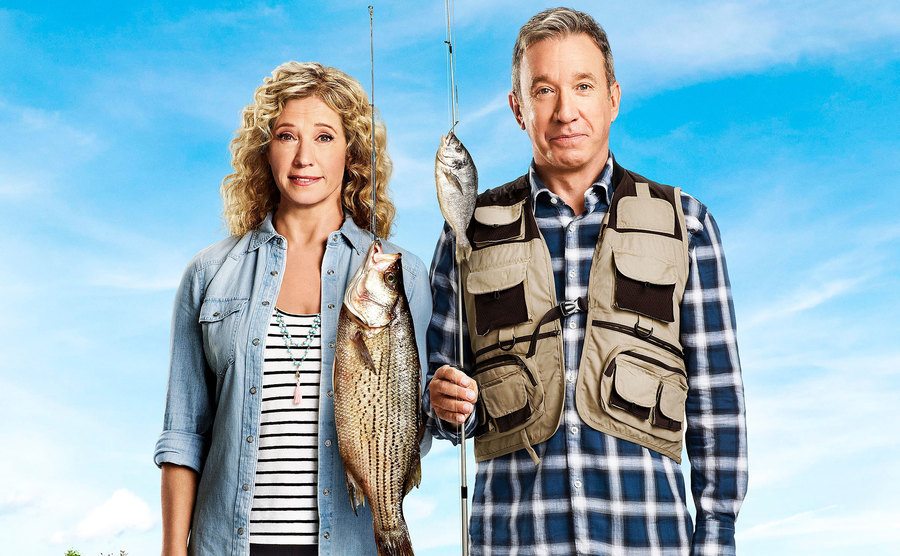 Tim Allen and Nancy Travis pose for a poster of Last Man Standing. 