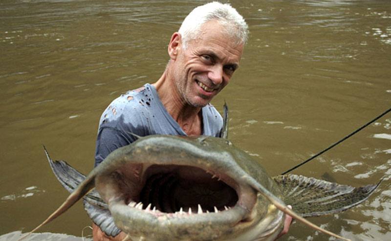 Jeremy Wade holds a scavenging catfish in an episode from the show.