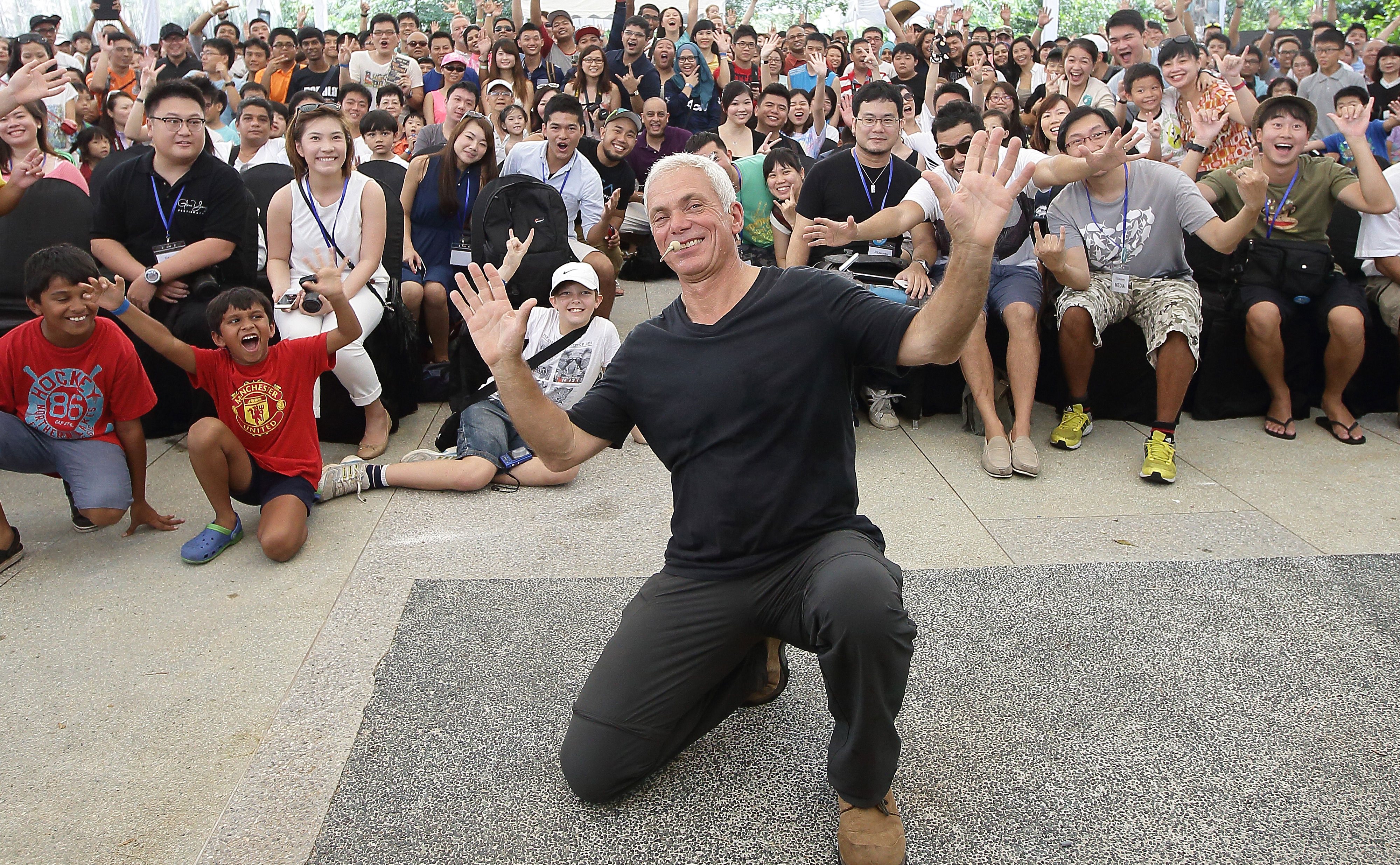 Jeremy Wade poses for a picture next to his fans.