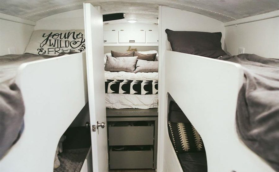 A view of the kid's bunk beds and the parent's bedroom. 
