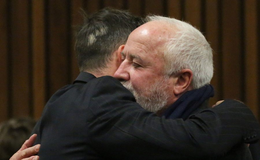 A picture of Pistorius embracing his father in court.