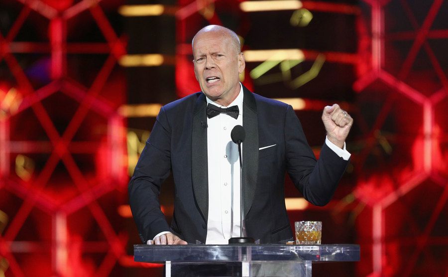 Bruce Willis speaks on stage.