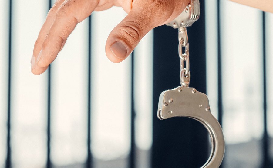 A photo of a man in handcuffs.