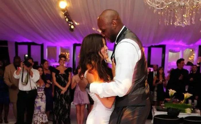 Khloe Kardashian and Lamar Odom dance at their wedding. 
