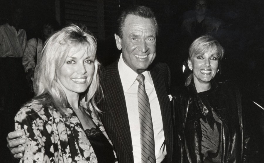 Dian Parkinson, Bob Barker, and Janice Pennington pose for a picture during an event.