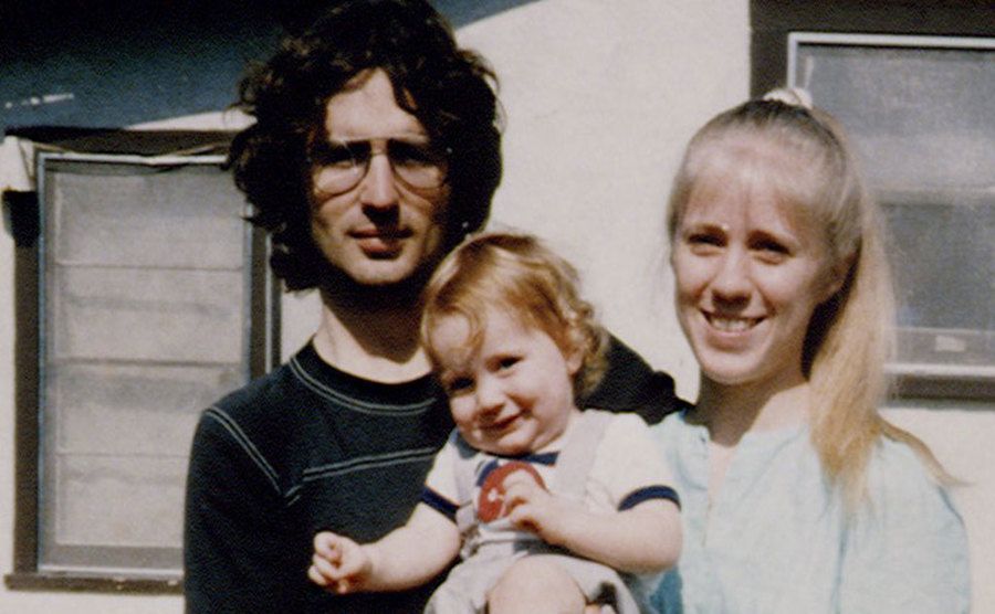 A photo of David Koresh with his wife and their son.