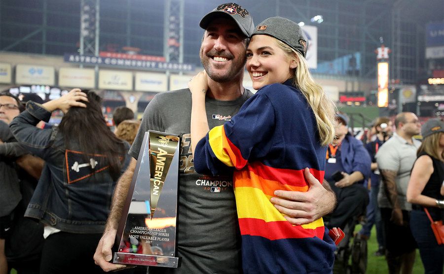 Justin Verlander with model Kate Upton and the MVP trophy. 