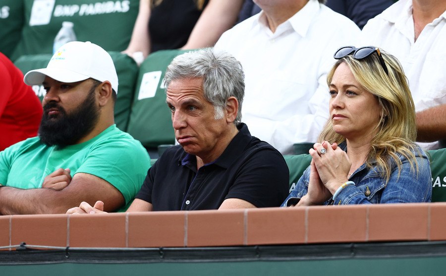 A photo of Stiller and Taylor watching a tennis game.