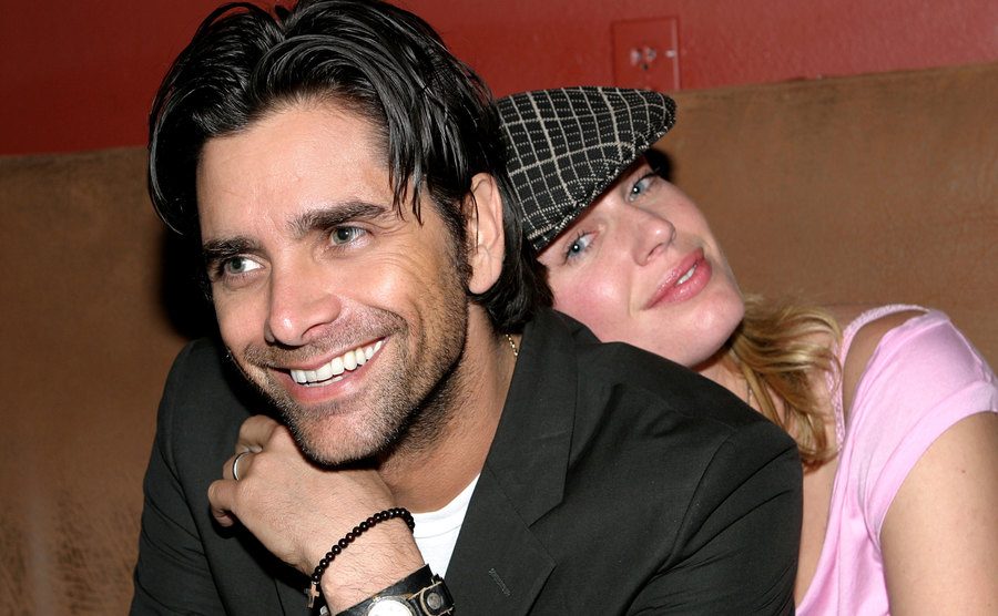A photo of Stamos and Romijn at a bar.