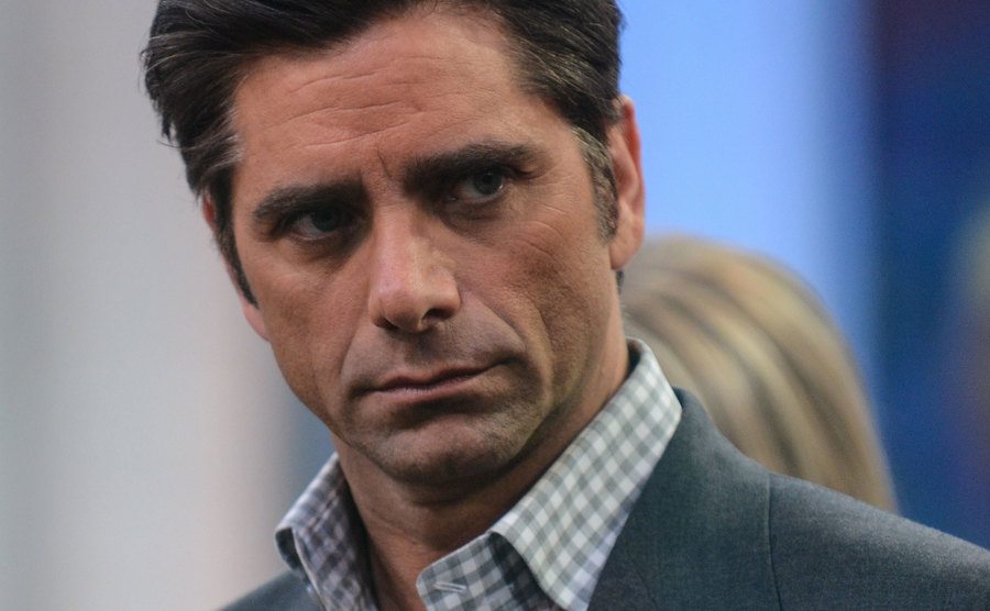 A photo of Stamos wearing a serious expression on his face.