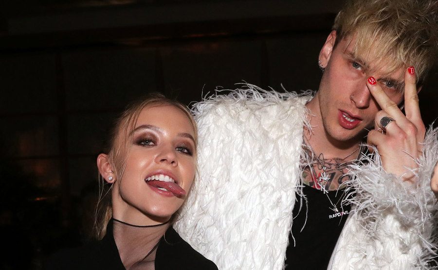 Sydney Sweeney and Machine Gun Kelly pose for a photo. 