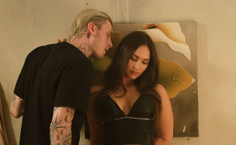 MGK and Megan Fox in a still from Midnight in the Switchgrass. 
